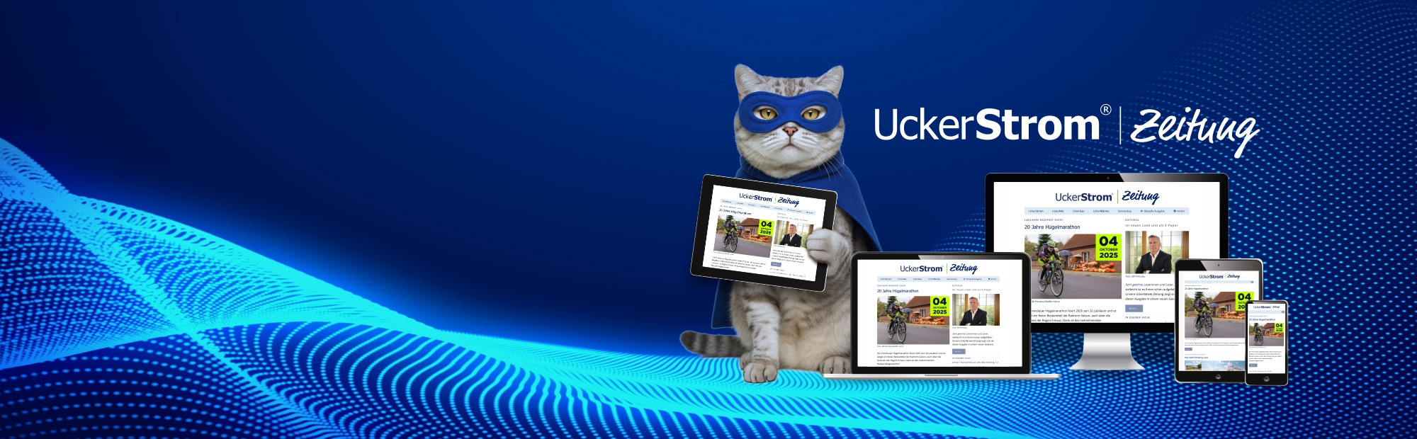 Katze mit Superheldenmaske präsentiert die Uckerstromzeitung in allen Digitalen Medien